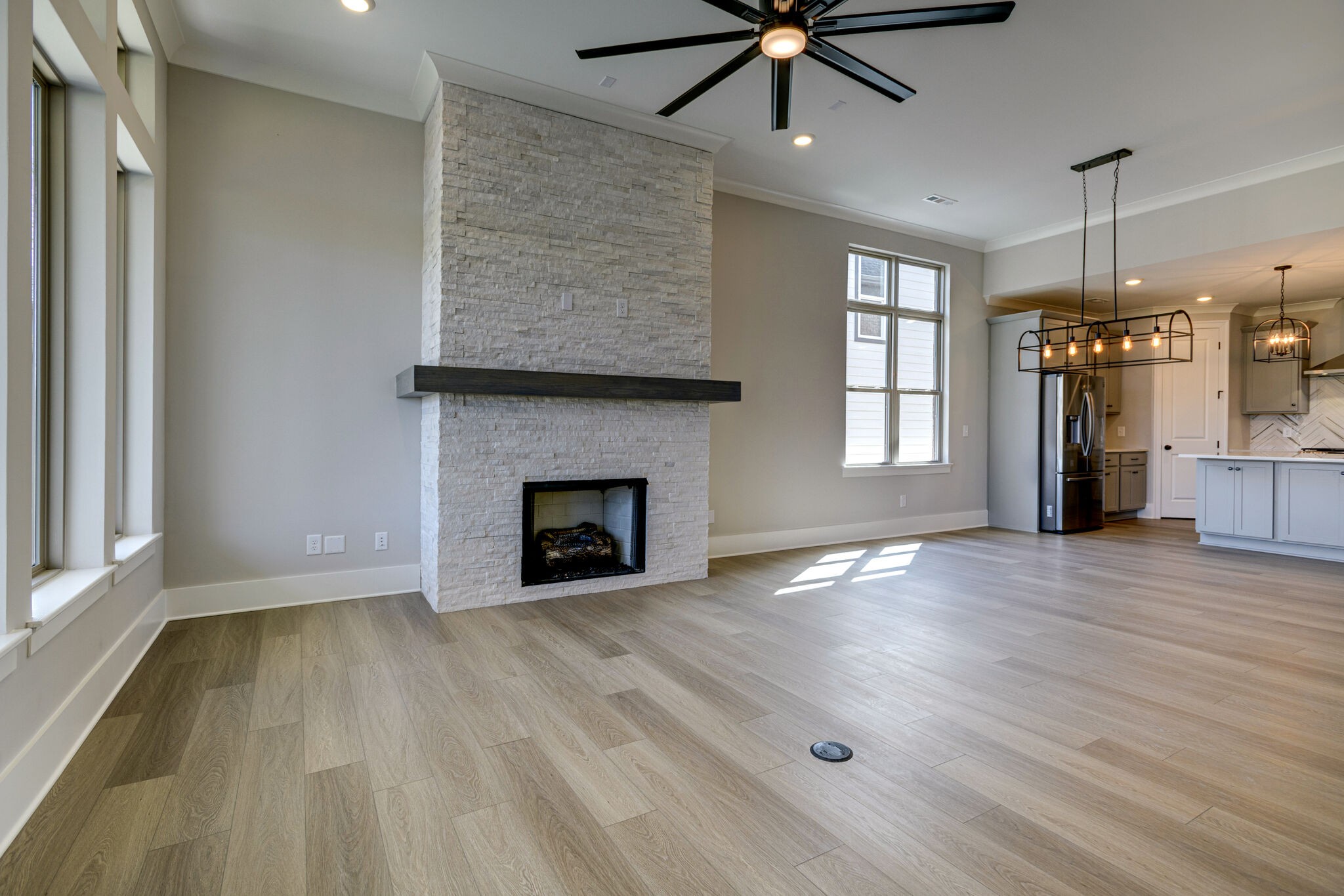 1057 Fallow Road Mount Juliet, TN 37122 - Photo 14 of 41 a view of empty room with wooden floor and fireplace