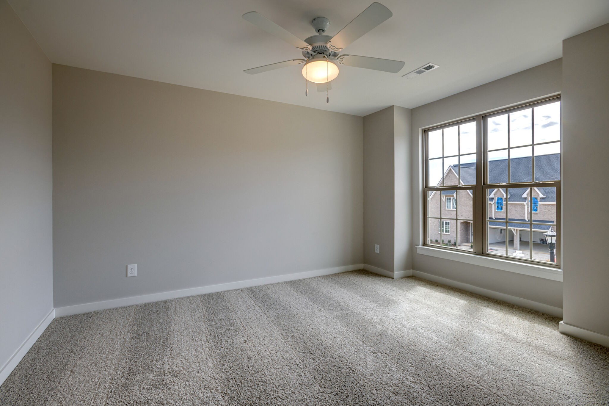 1057 Fallow Road Mount Juliet, TN 37122 - Photo 29 of 41 an empty room with chandelier fan and windows