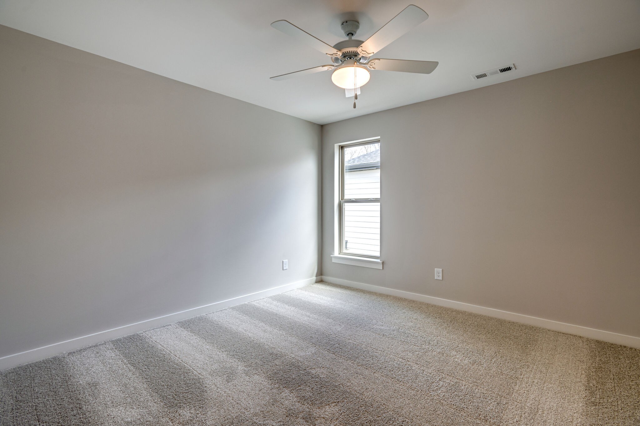 1057 Fallow Road Mount Juliet, TN 37122 - Photo 30 of 41 an empty room with windows and ceiling fan