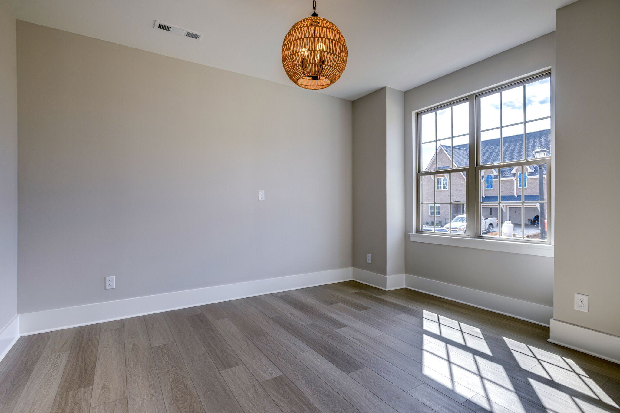1057 Fallow Road Mount Juliet, TN 37122 - Photo 6 of 41 an empty room with wooden floor and windows