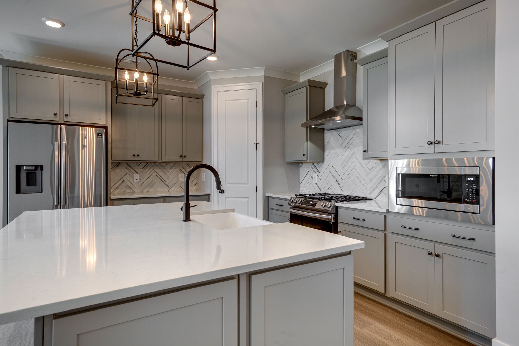 1057 Fallow Road Mount Juliet, TN 37122 - Photo 8 of 41 a kitchen with stainless steel appliances a sink dishwasher a refrigerator and white cabinets
