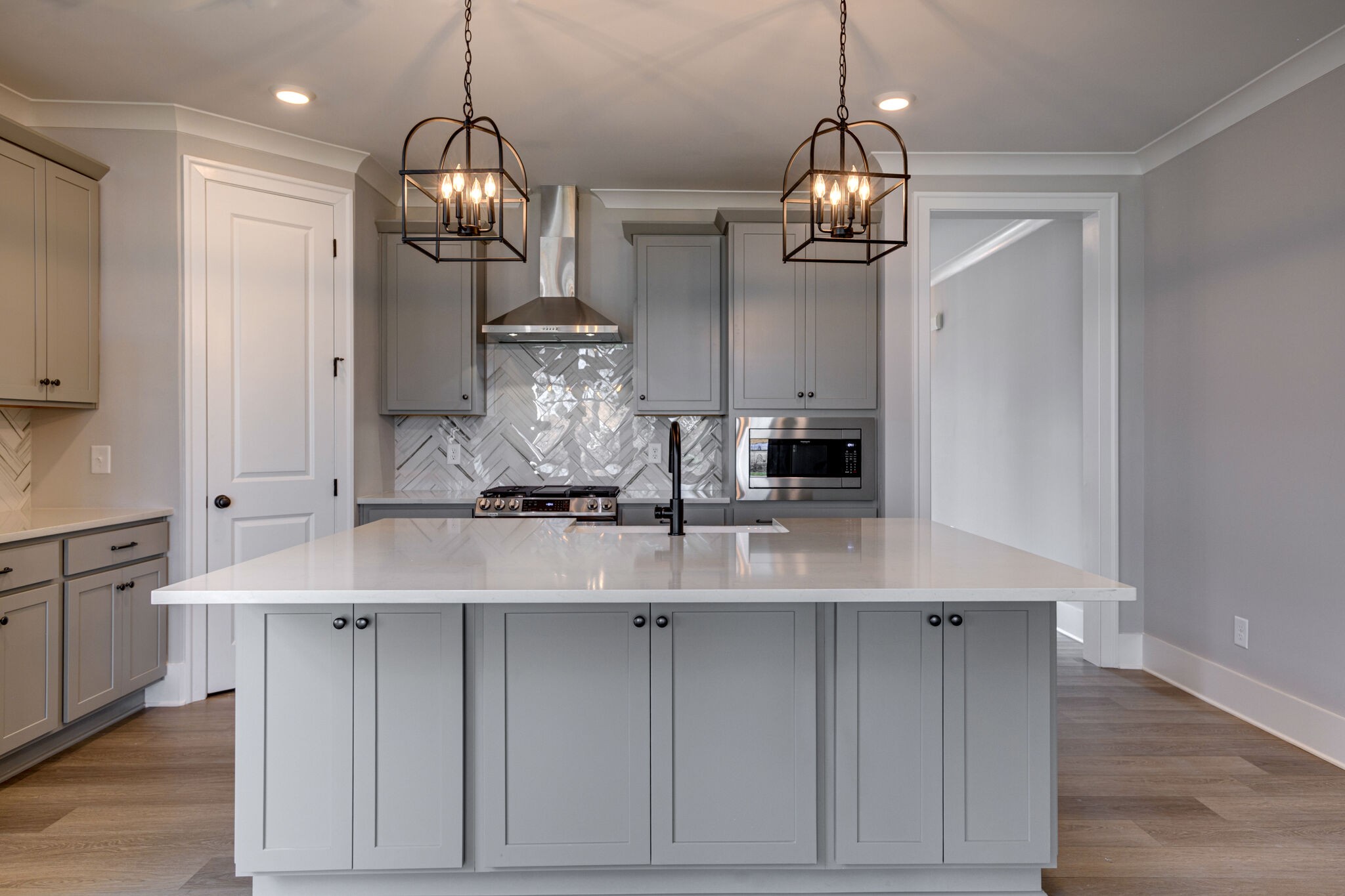 1057 Fallow Road Mount Juliet, TN 37122 - Photo 9 of 41 a kitchen with kitchen island granite countertop a sink cabinets and stainless steel appliances