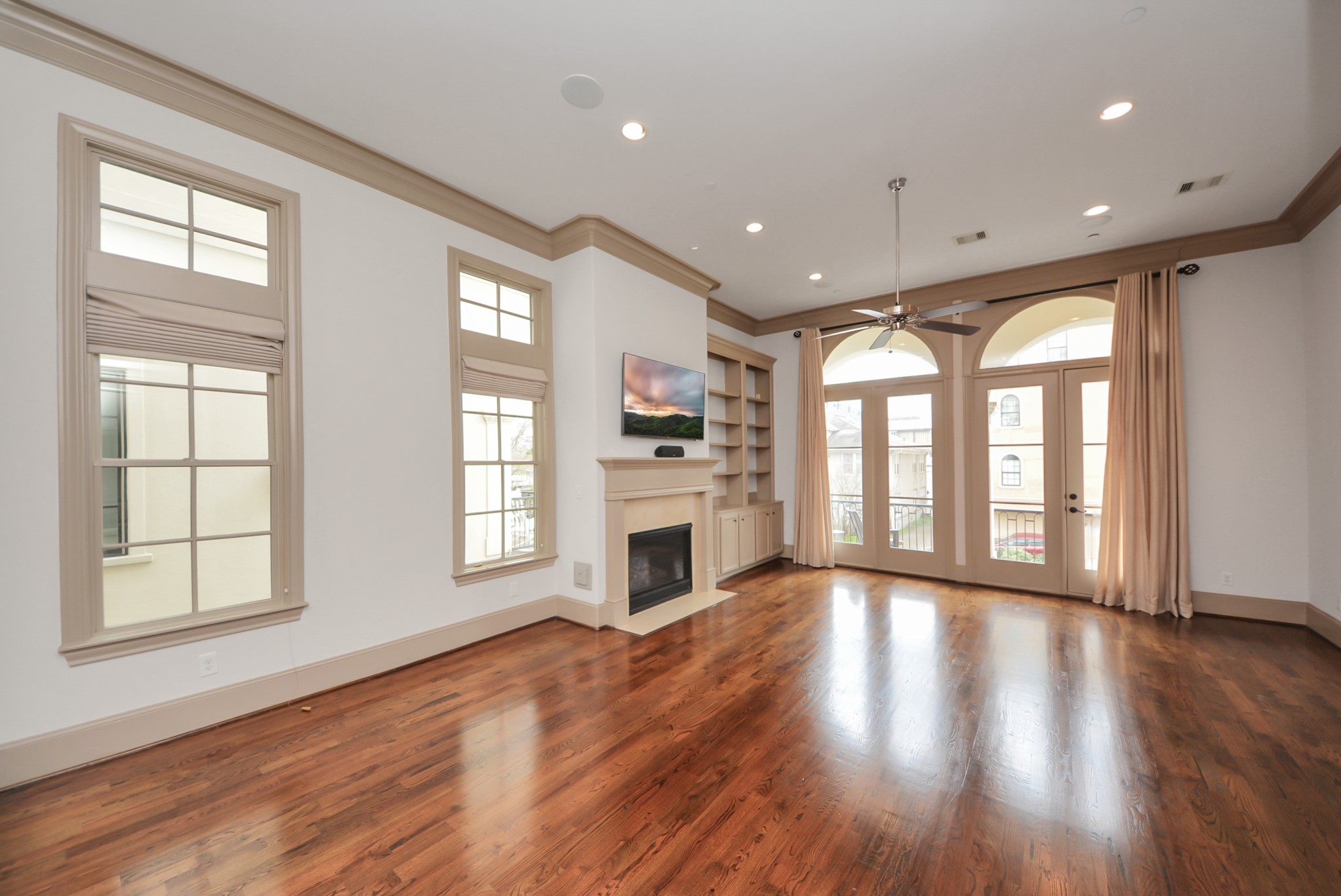 314 West Clay Street Houston, TX 77019 - Photo 12 of 44 a view of an empty room with wooden floor and a window