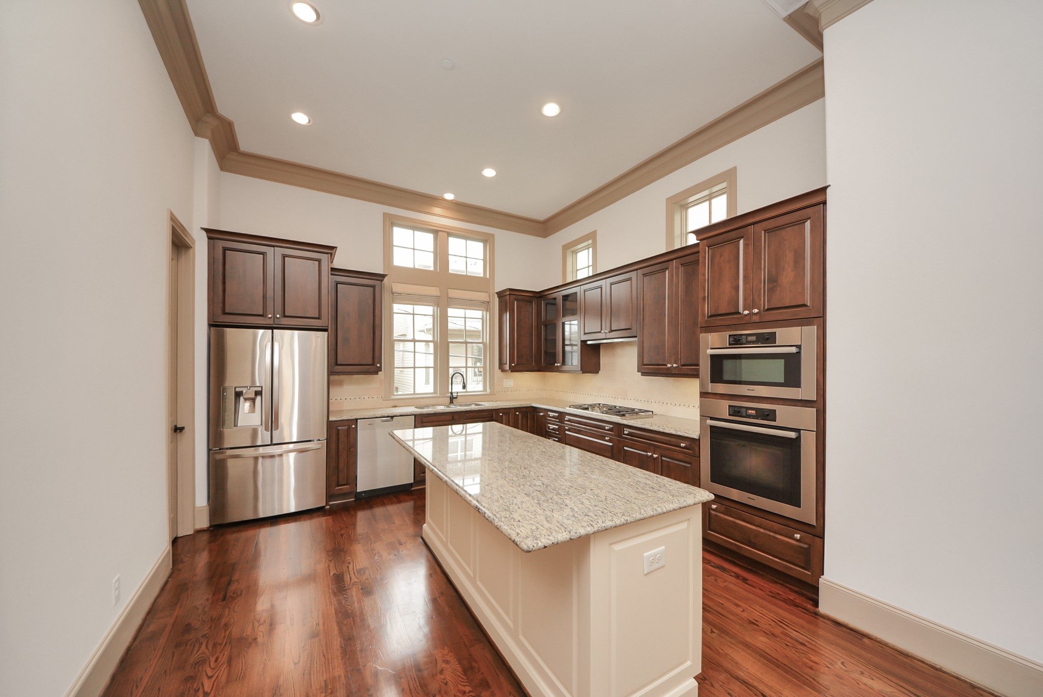 314 West Clay Street Houston, TX 77019 - Photo 16 of 44 a kitchen with stainless steel appliances granite countertop a refrigerator and a stove top oven