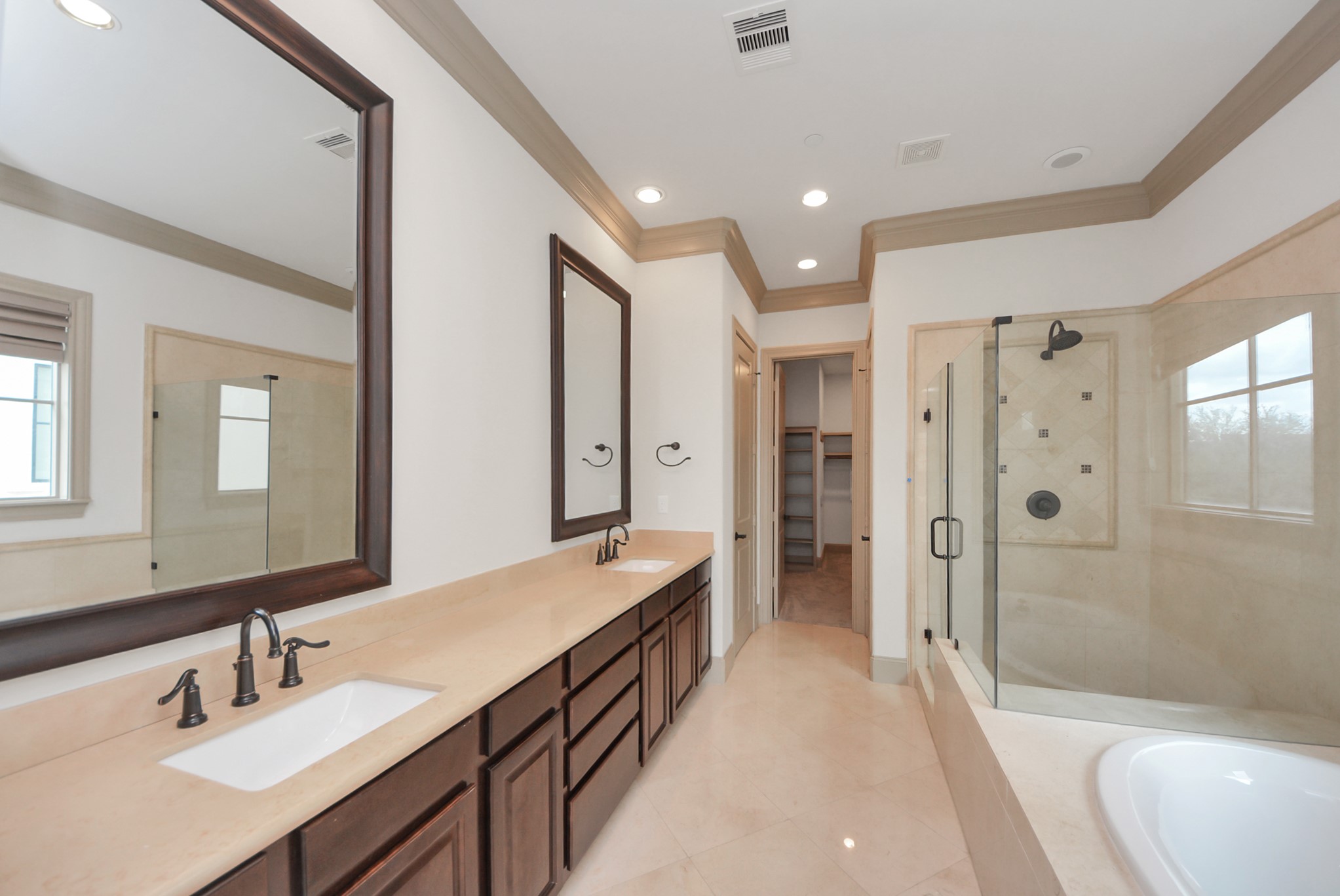 314 West Clay Street Houston, TX 77019 - Photo 30 of 44 a spacious bathroom with a shower tub double vanity and a mirror