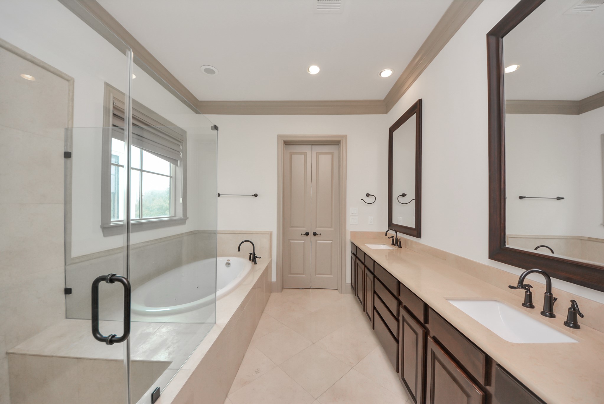 314 West Clay Street Houston, TX 77019 - Photo 31 of 44 a spacious bathroom with a tub double sink and mirror