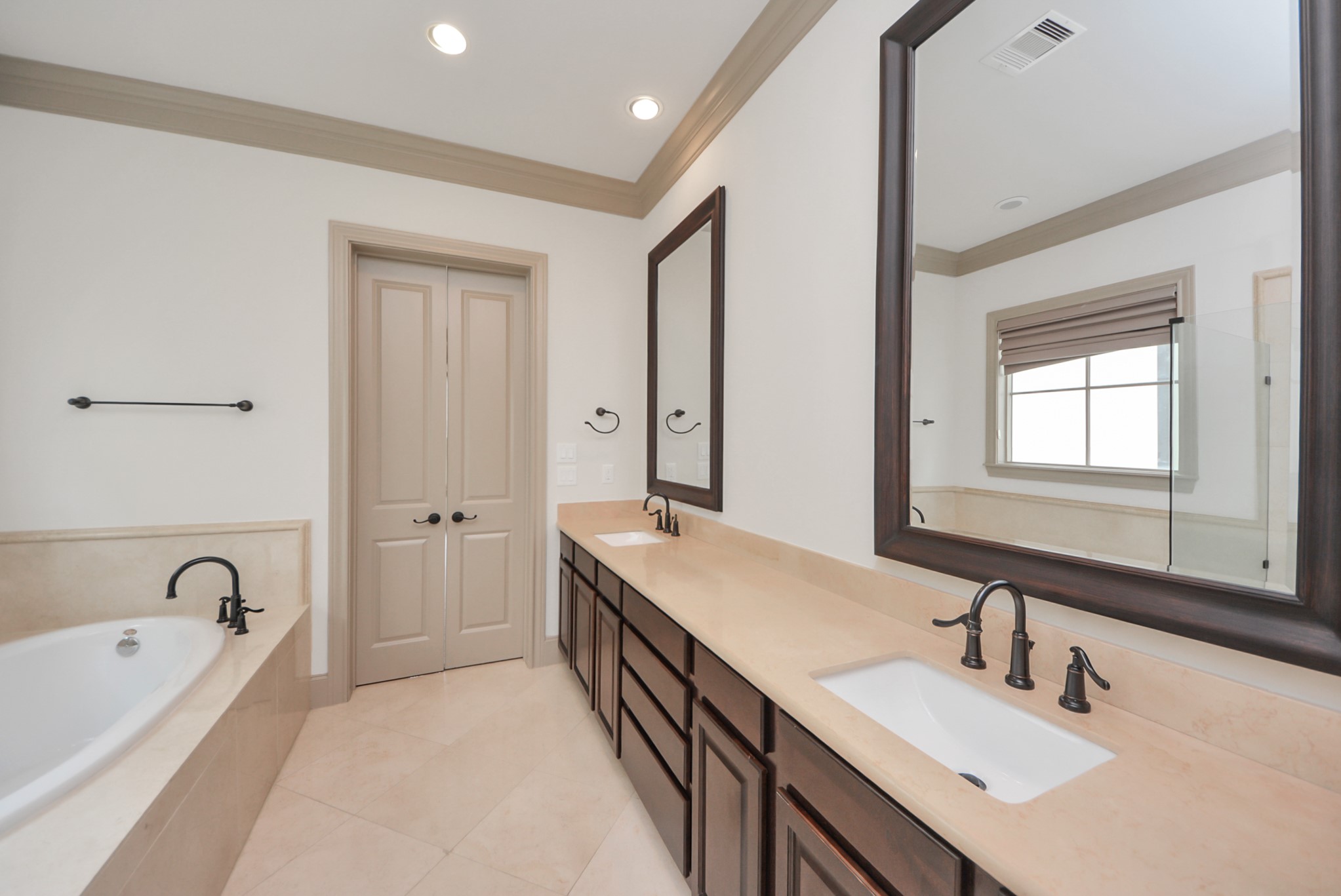314 West Clay Street Houston, TX 77019 - Photo 32 of 44 a spacious bathroom with a bathtub sink and mirror
