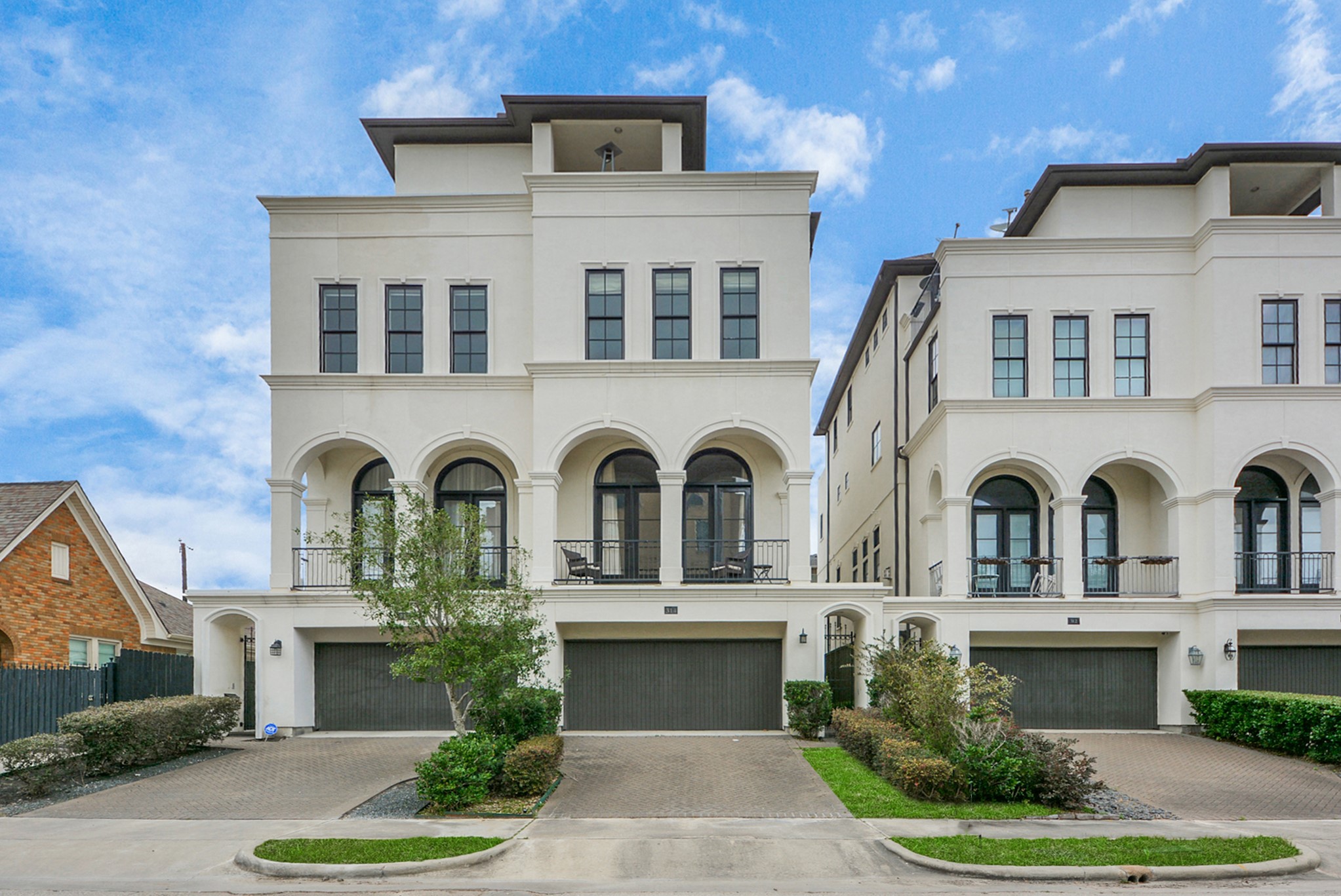 314 West Clay Street Houston, TX 77019 - Photo 4 of 44 a front view of a house with garden