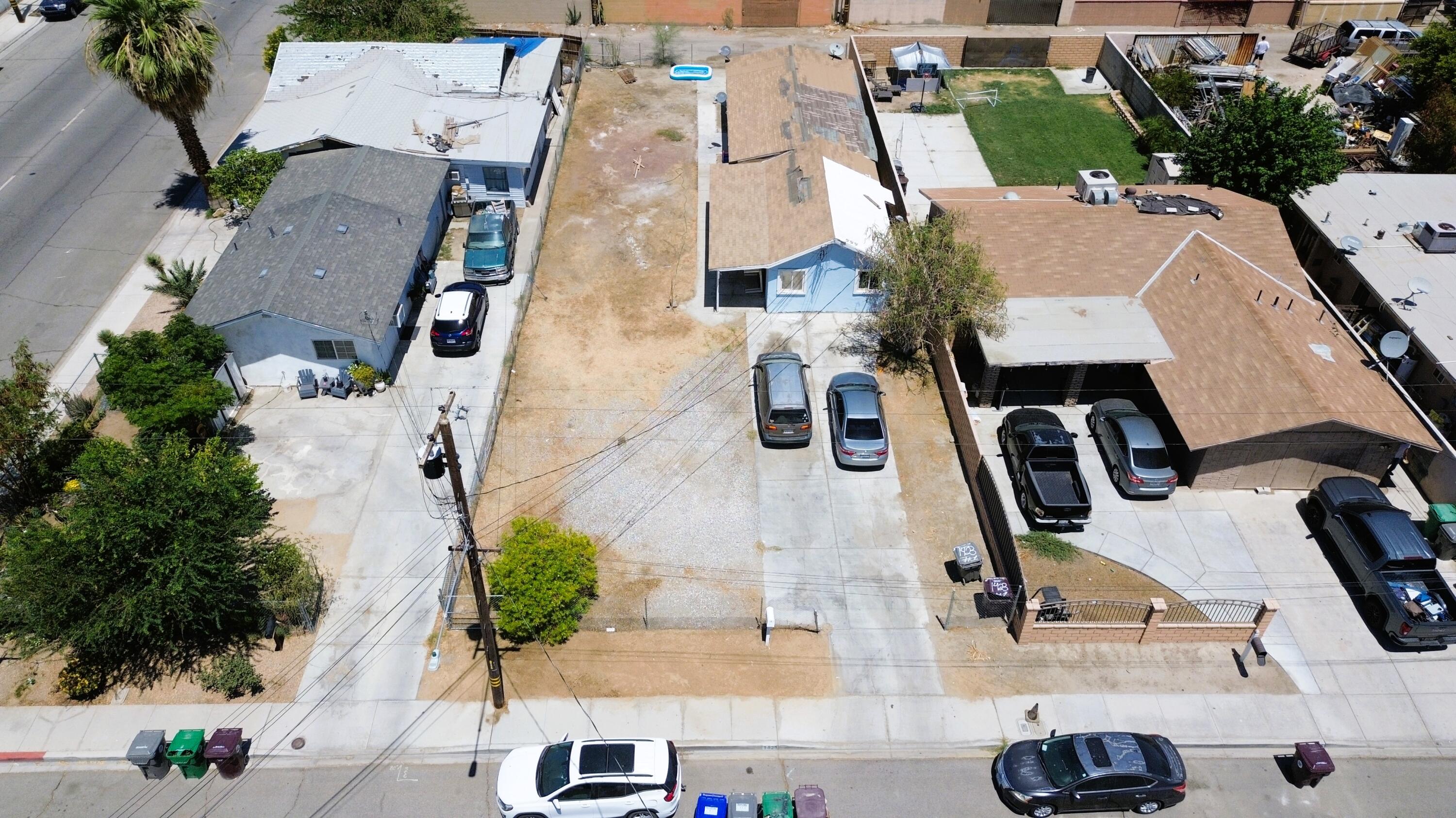 1423 2nd Street Coachella, CA 92236 - Photo 4 of 12 an aerial view of residential houses with outdoor space