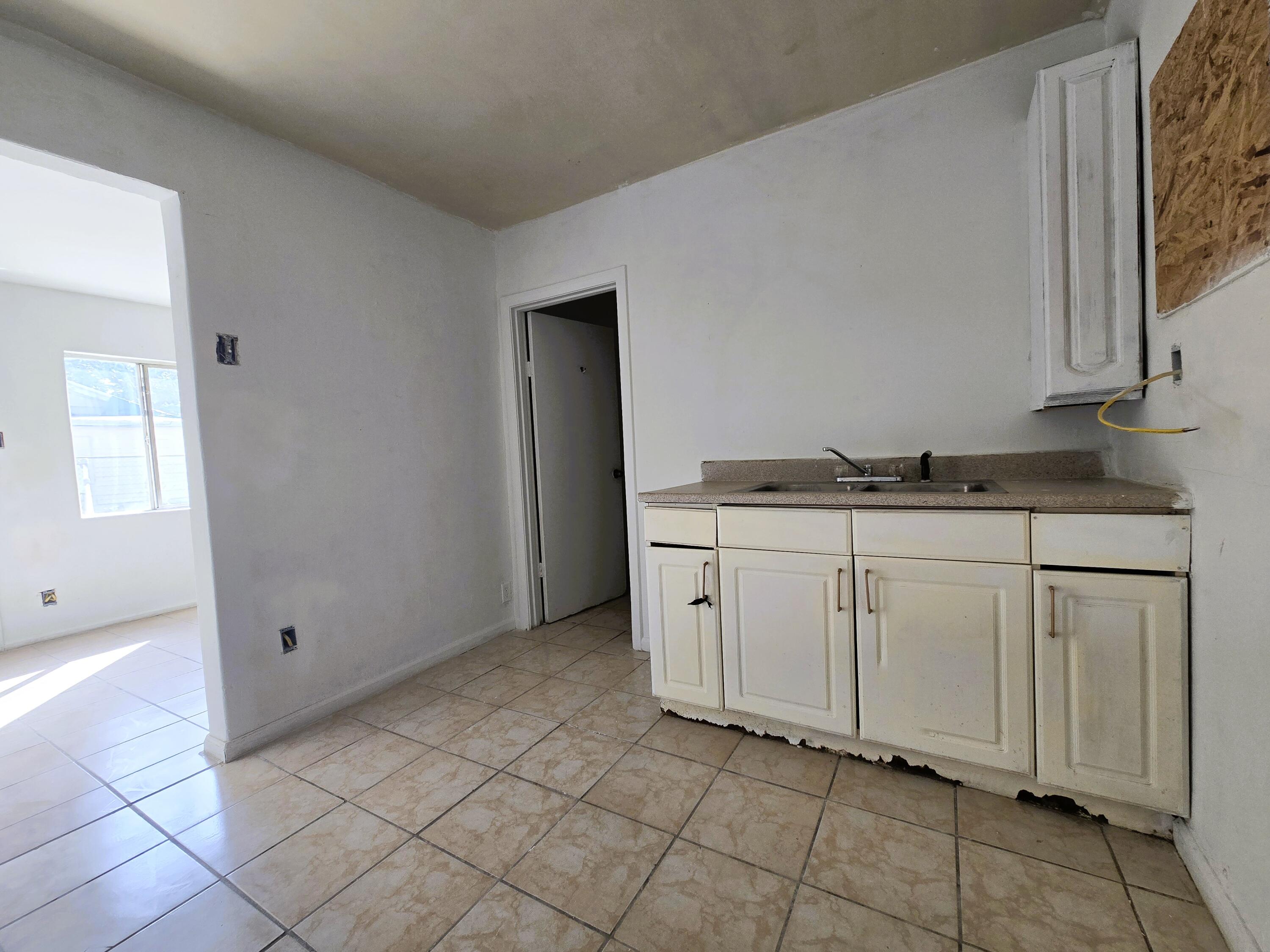 1423 2nd Street Coachella, CA 92236 - Photo 9 of 12 a view of a kitchen with white cabinets