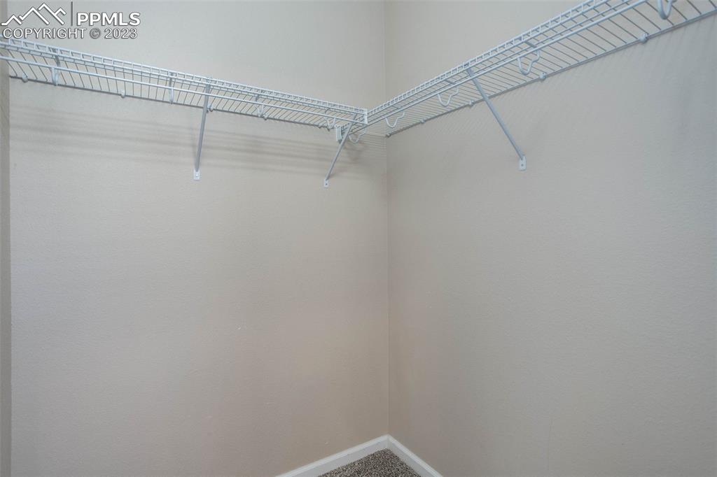 605 Cougar Bluff Point, Unit 210 Colorado Springs, CO 80906 - Photo 29 of 33 a view of a room with racks on the wall