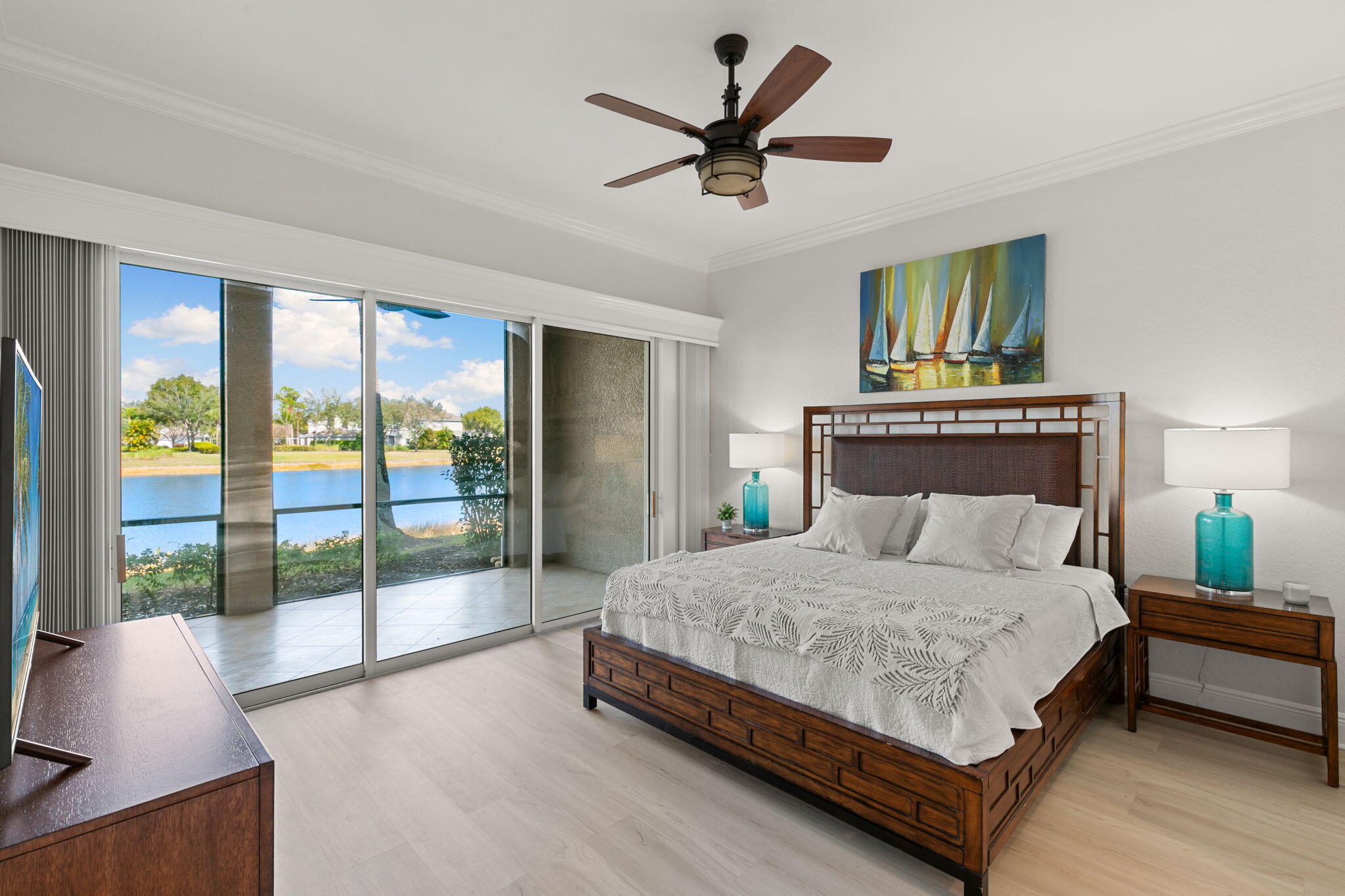 9213 Museo Circle, Unit 103 Naples, FL 34114 - Photo 14 of 47 a bedroom with a large bed and a large window