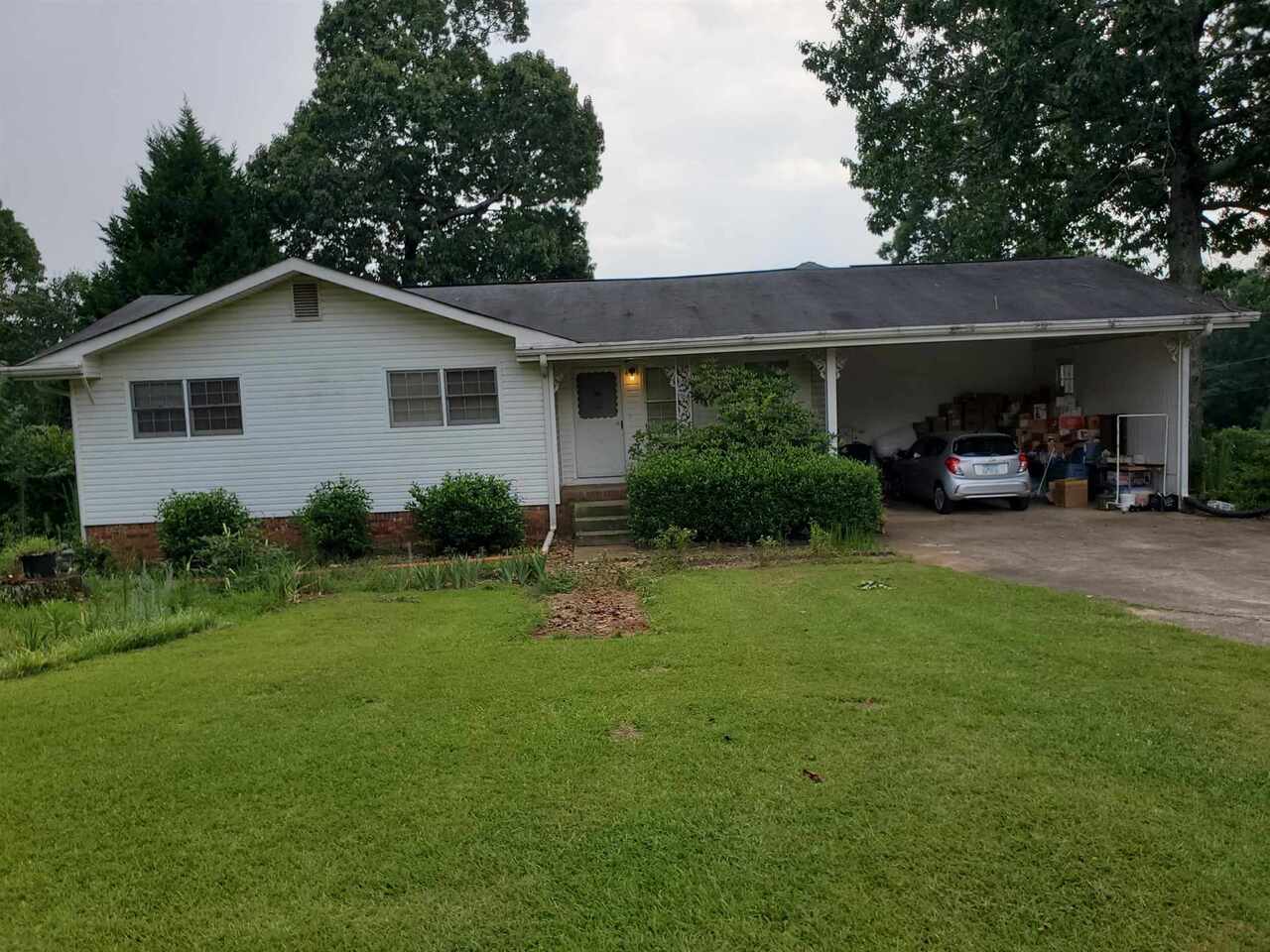 328 Davis Road Stockbridge, GA 30281 - Photo 1 of 1 a house view with a garden space
