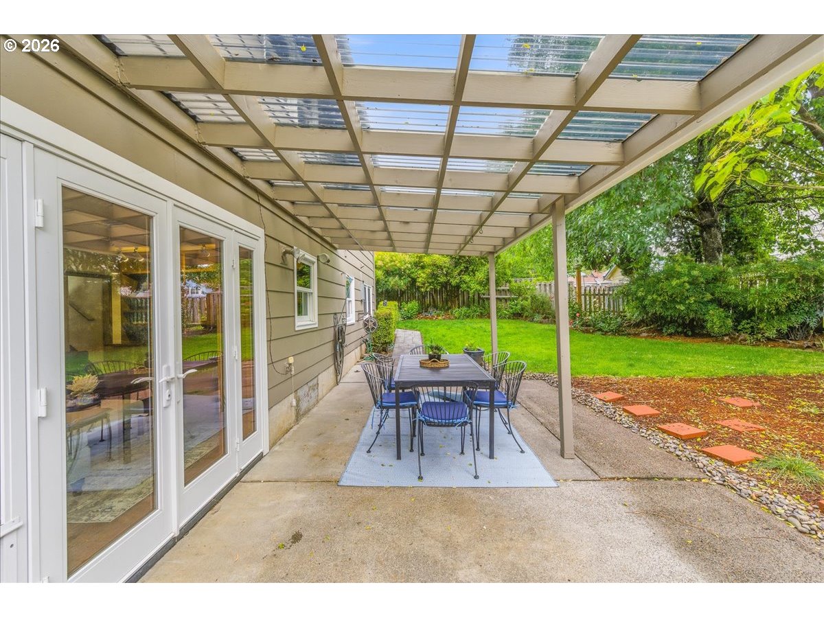 3130 Southwest 116th Avenue Beaverton, OR 97005 - Photo 33 of 44 a view of a patio with table and chairs next to a yard