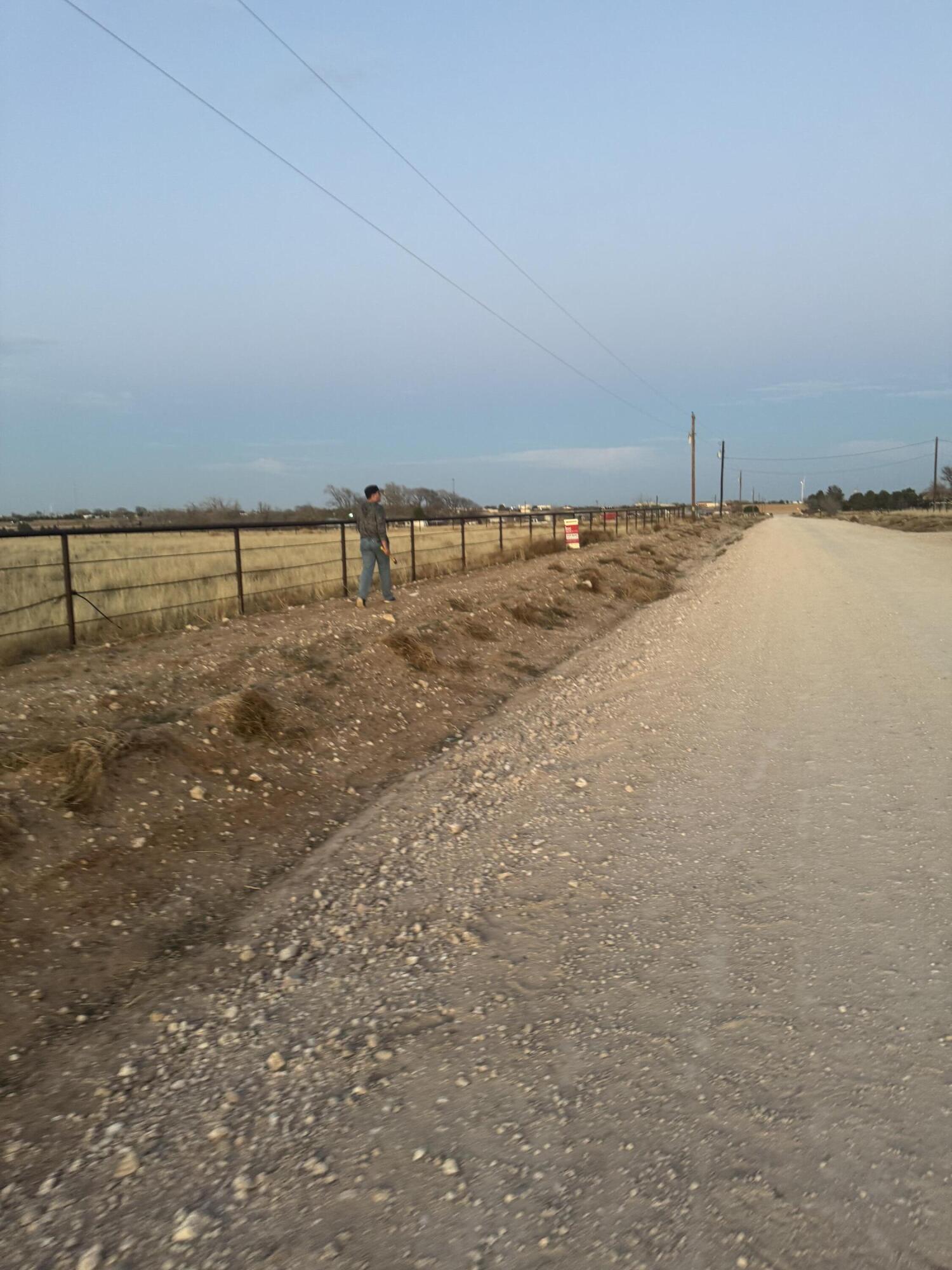 Bearcat Rd Bearcat Lubbock, TX 79407 - Photo 6 of 6 a view of a dry yard with wooden fence
