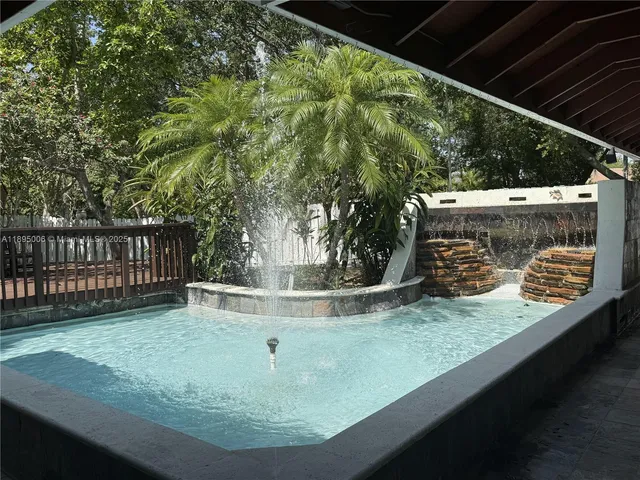 a kitchen with a wooden table and chairs