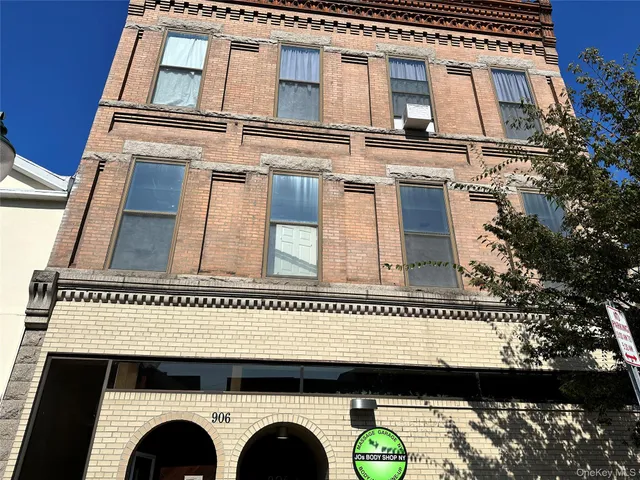 a view of building with a balcony