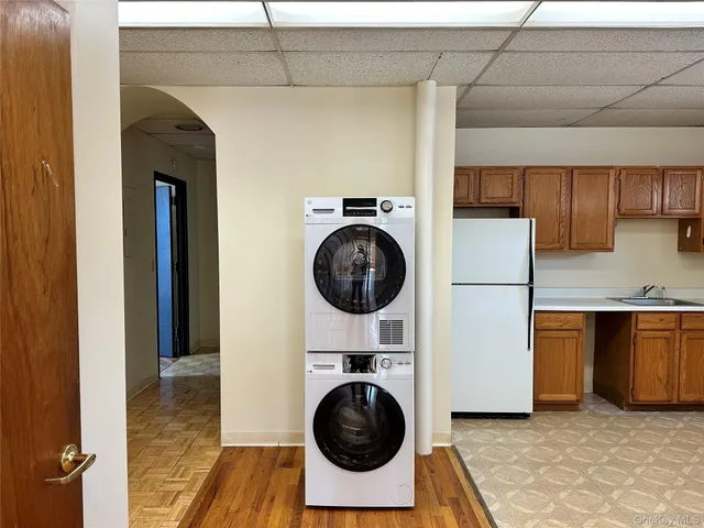 a utility room with sink dryer and washer