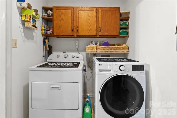a utility room with dryer and washer