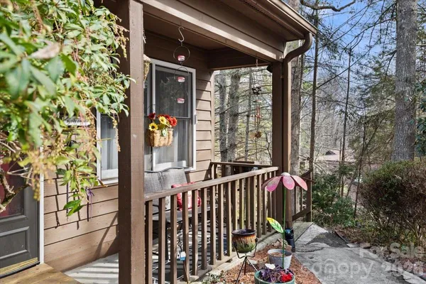 a view of balcony with glass door and outdoor seating