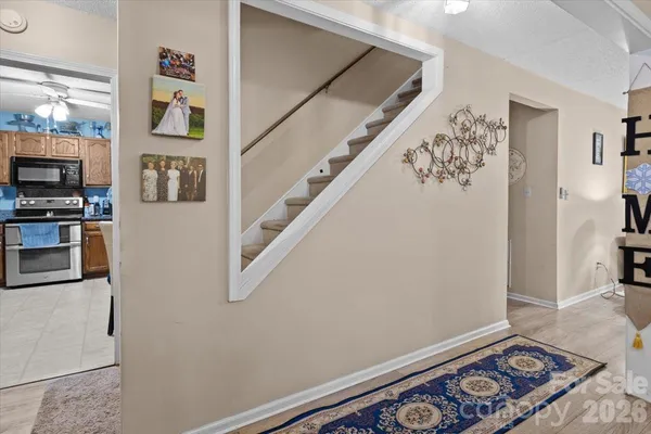 a view of livingroom with furniture and workspace