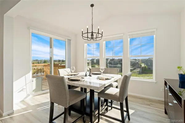 a view of a dining room with furniture window and outside view