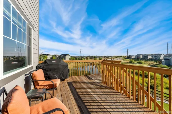 a balcony with wooden floor