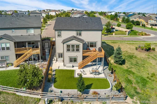an aerial view of a house with a swimming pool