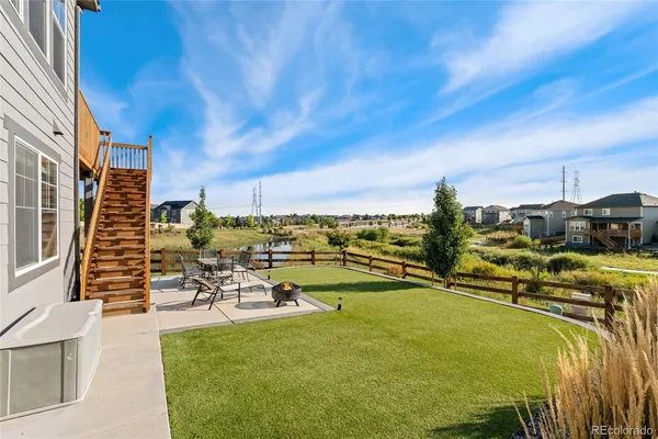 a view of a swimming pool with outdoor seating