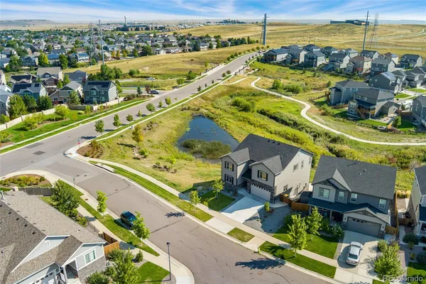 an aerial view of a house with a ocean view