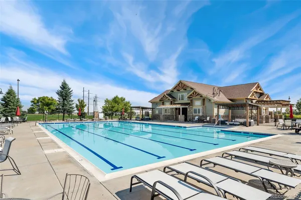 a view of a house with backyard porch and sitting area