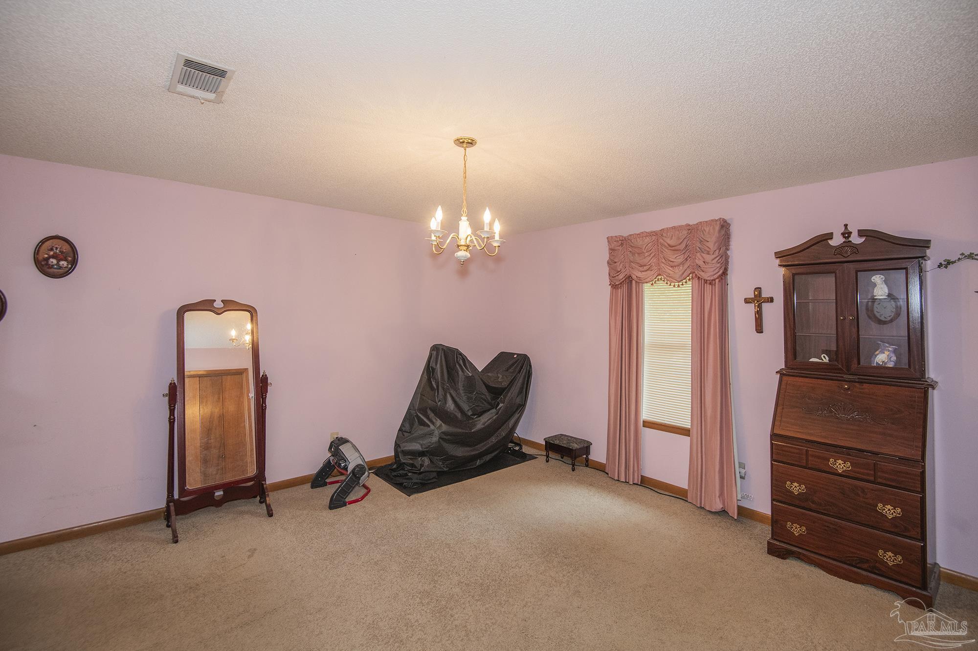 1210 Goldenrod Road Cantonment, FL 32533 - Photo 22 of 50 a view of a room with gym equipment