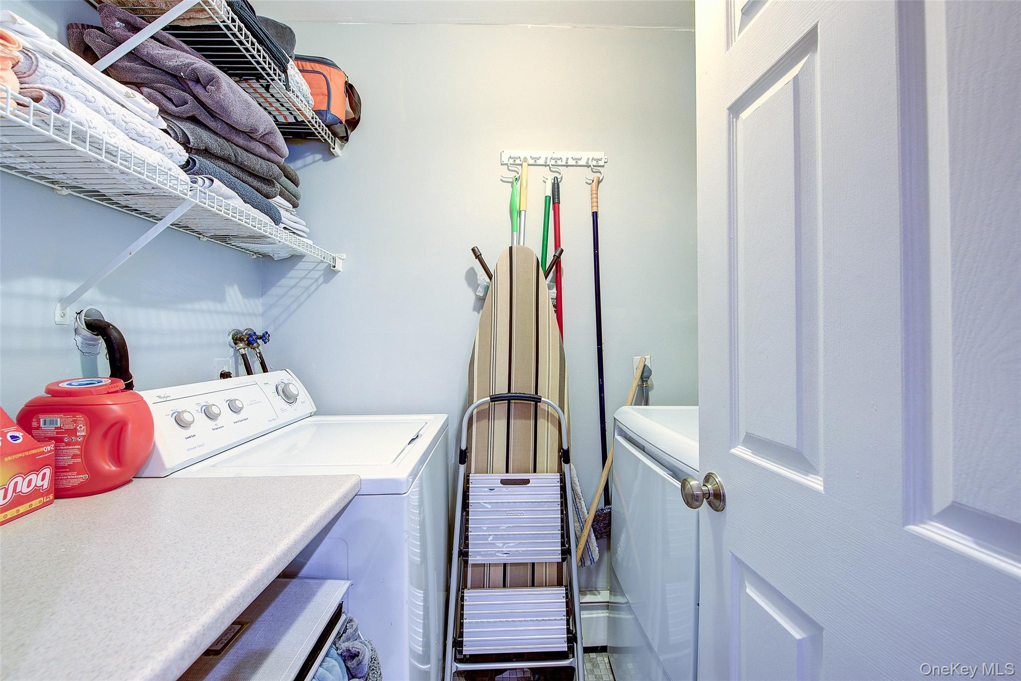 161 Beach 128th Street, Unit 1B Queens, NY 11694 - Photo 19 of 36 Laundry room with washing machine and clothes dryer