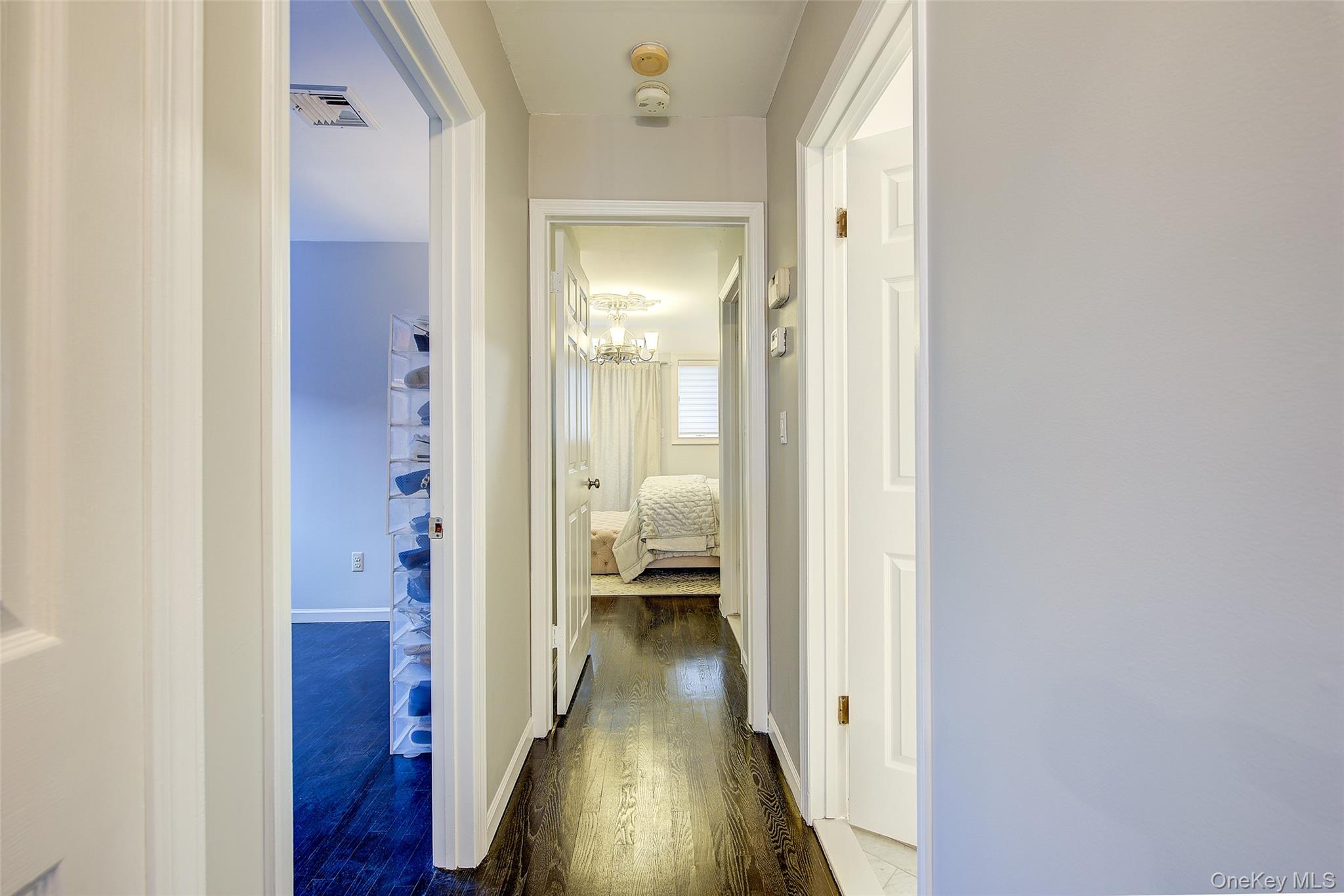161 Beach 128th Street, Unit 1B Queens, NY 11694 - Photo 20 of 36 a view of a hallway with wooden floor and closet