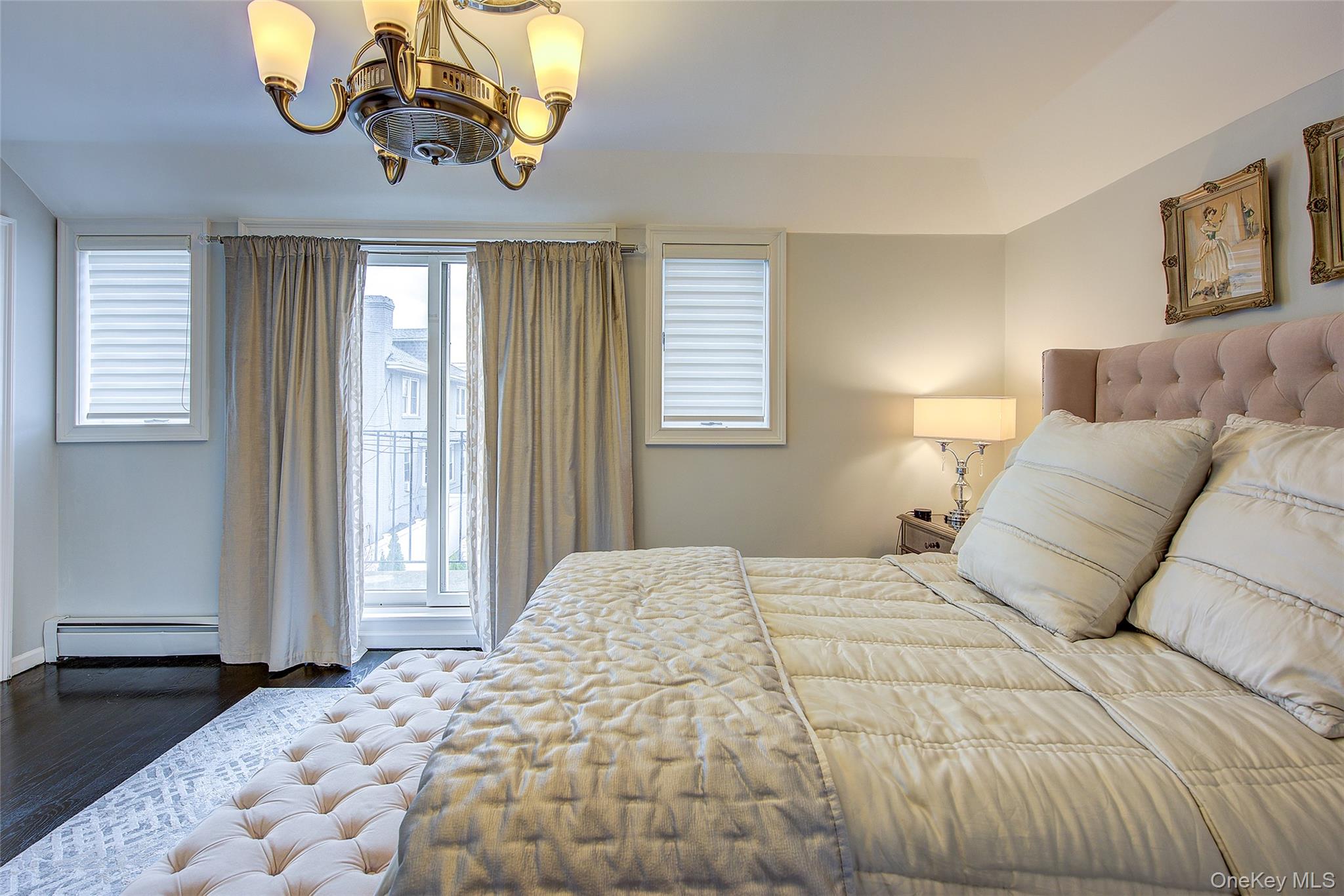 161 Beach 128th Street, Unit 1B Queens, NY 11694 - Photo 24 of 36 a bedroom with a bed and a window