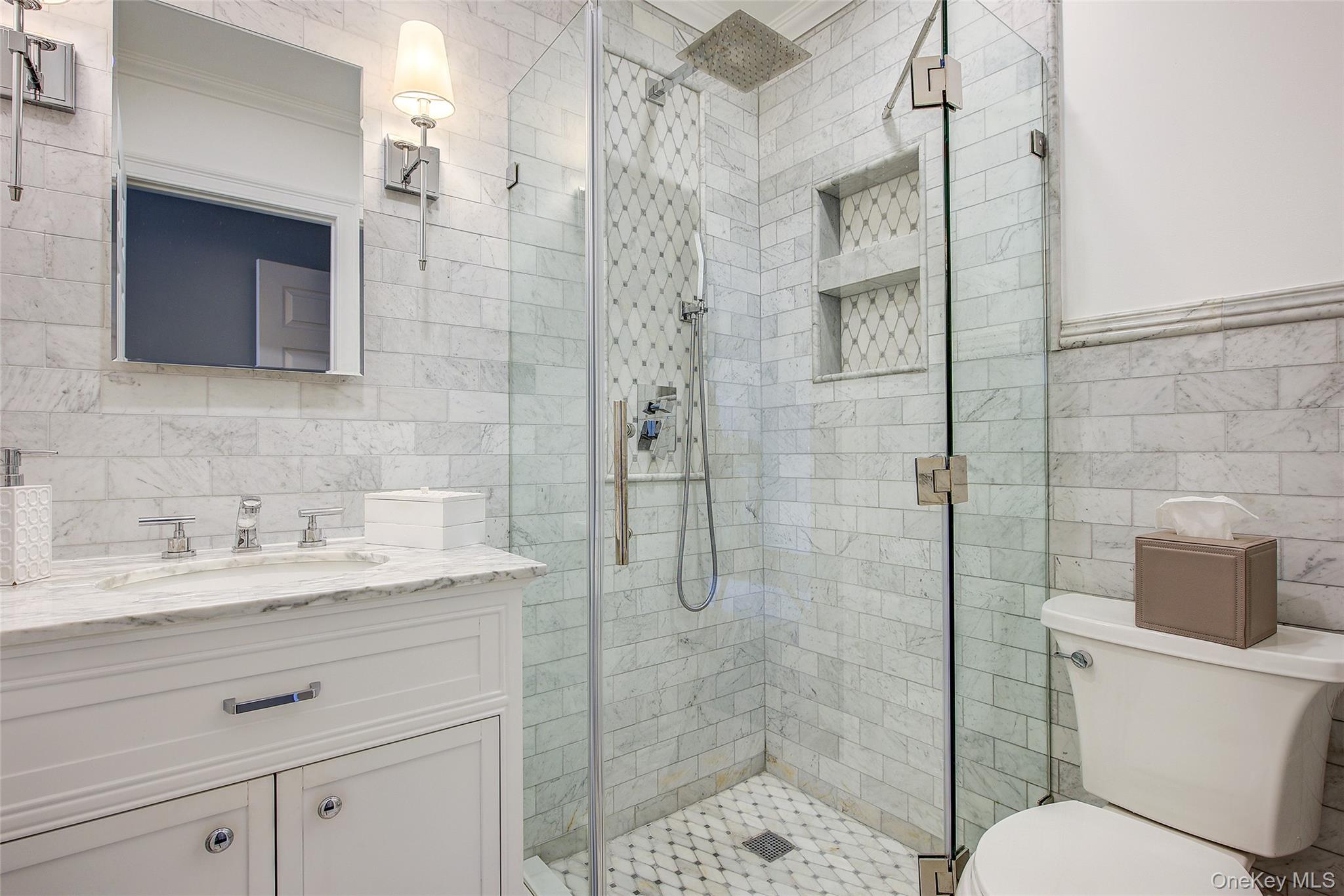 161 Beach 128th Street, Unit 1B Queens, NY 11694 - Photo 28 of 36 a bathroom with a granite countertop sink toilet and shower