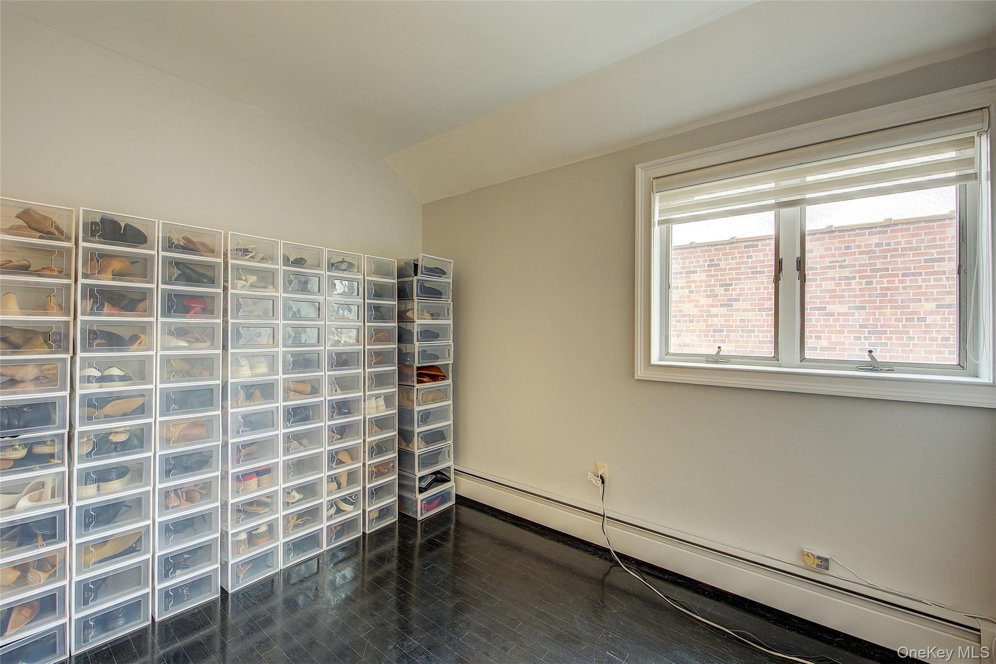 161 Beach 128th Street, Unit 1B Queens, NY 11694 - Photo 31 of 36 a view of an empty room with a window