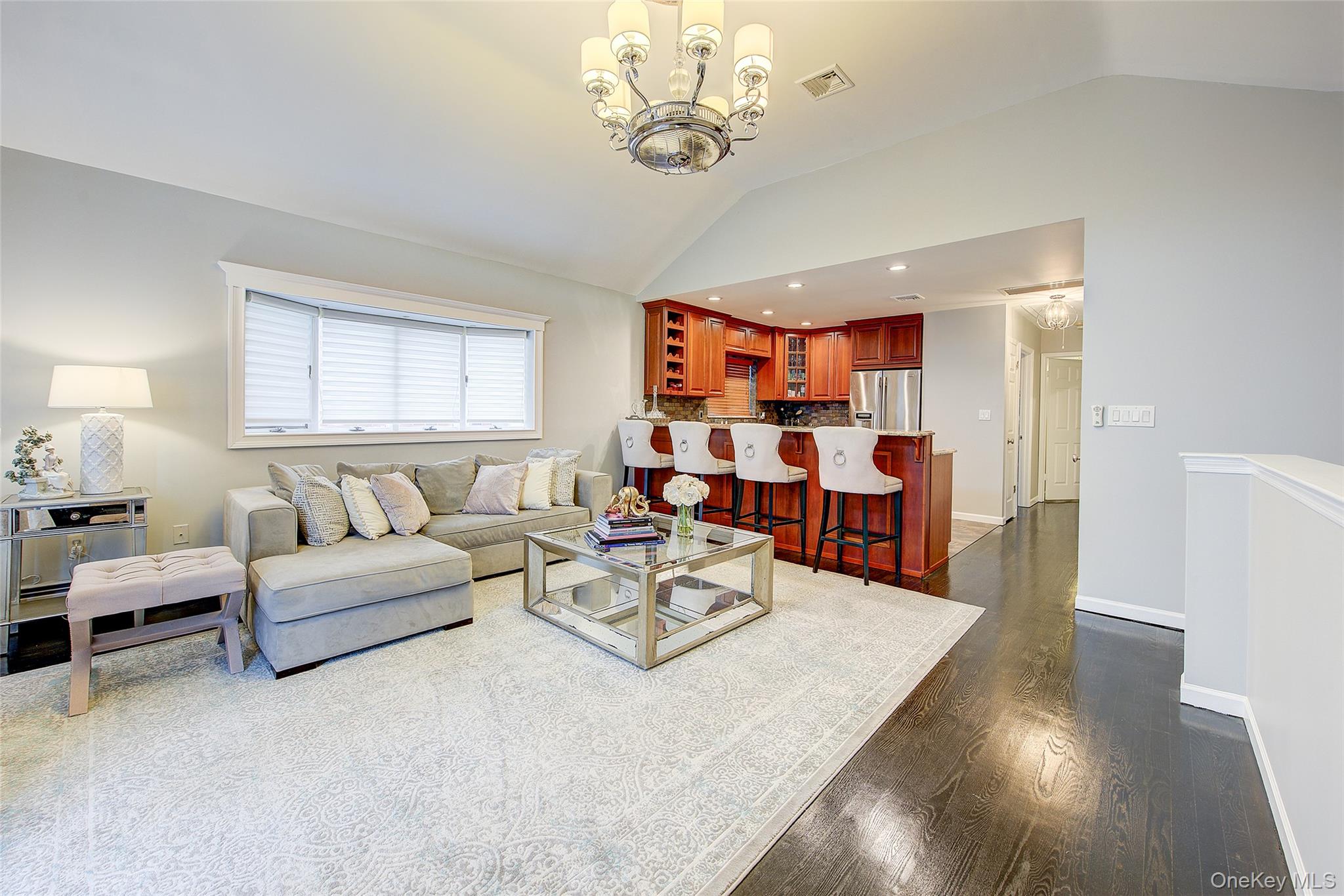 161 Beach 128th Street, Unit 1B Queens, NY 11694 - Photo 9 of 36 a living room with furniture and wooden floor