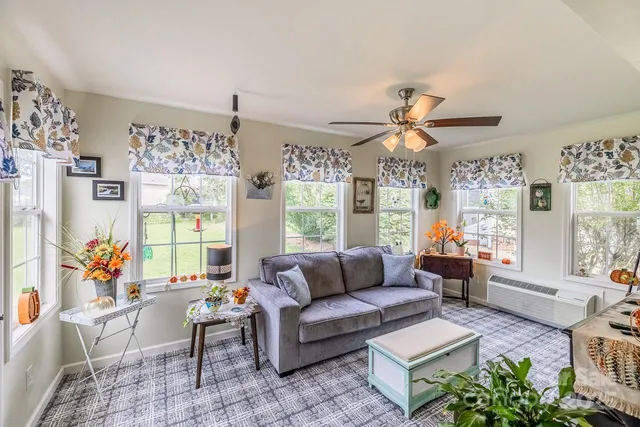 a living room with furniture and a large window
