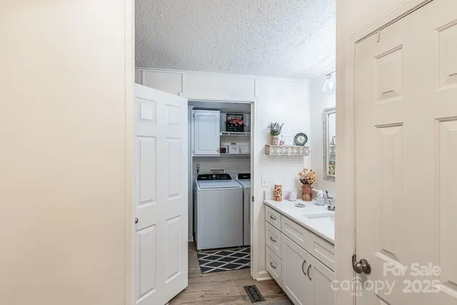 a kitchen with a refrigerator and cabinets