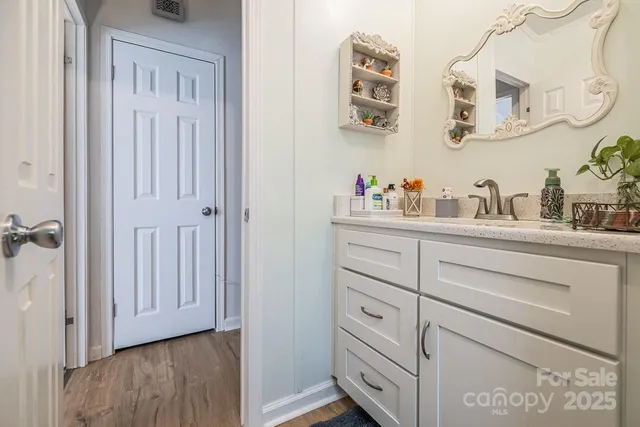 a view of a backyard with plants and a garden