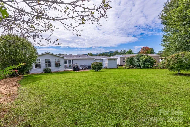 a view of a house with a big yard