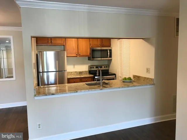 a view of a kitchen with a large window