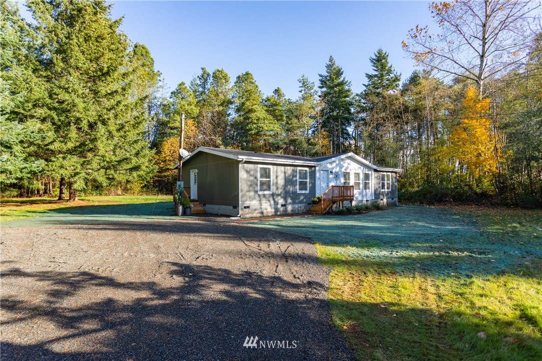 3116 Creasey Road Custer, WA 98240 - Photo 1 of 28 a front view of house with yard and trees in the background