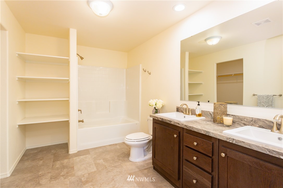 3116 Creasey Road Custer, WA 98240 - Photo 14 of 28 a bathroom with a double vanity sink toilet mirror and bathtub