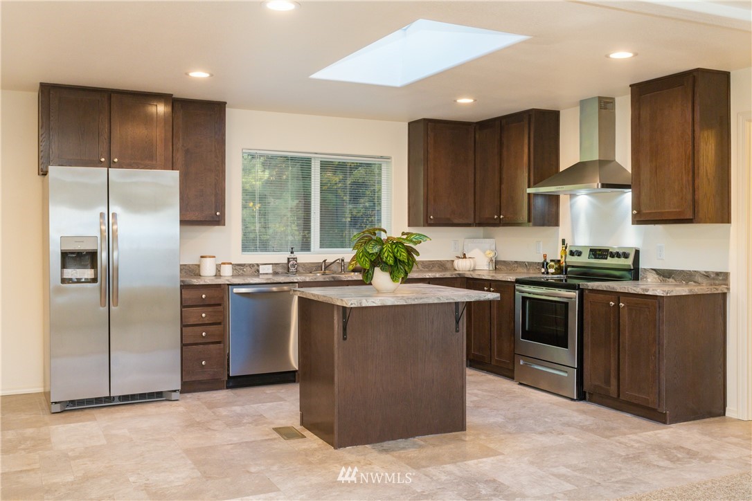 3116 Creasey Road Custer, WA 98240 - Photo 8 of 28 a kitchen with stainless steel appliances granite countertop a stove a sink dishwasher a refrigerator and a oven