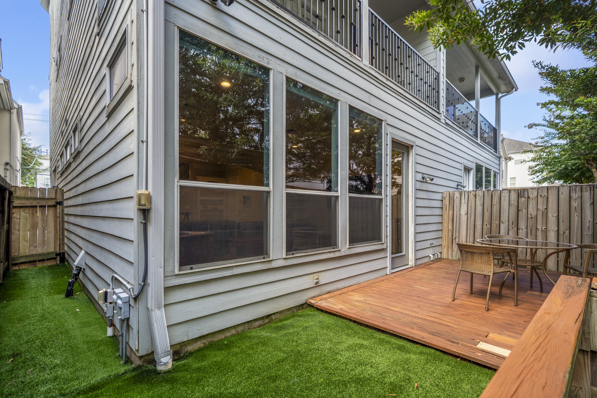 4236 Drake Street Houston, TX 77005 - Photo 38 of 43 There is no shortage of outdoor space access in this home. The backyard has direct access from the gated front entry, which leads directly to the fully-fenced backyard.