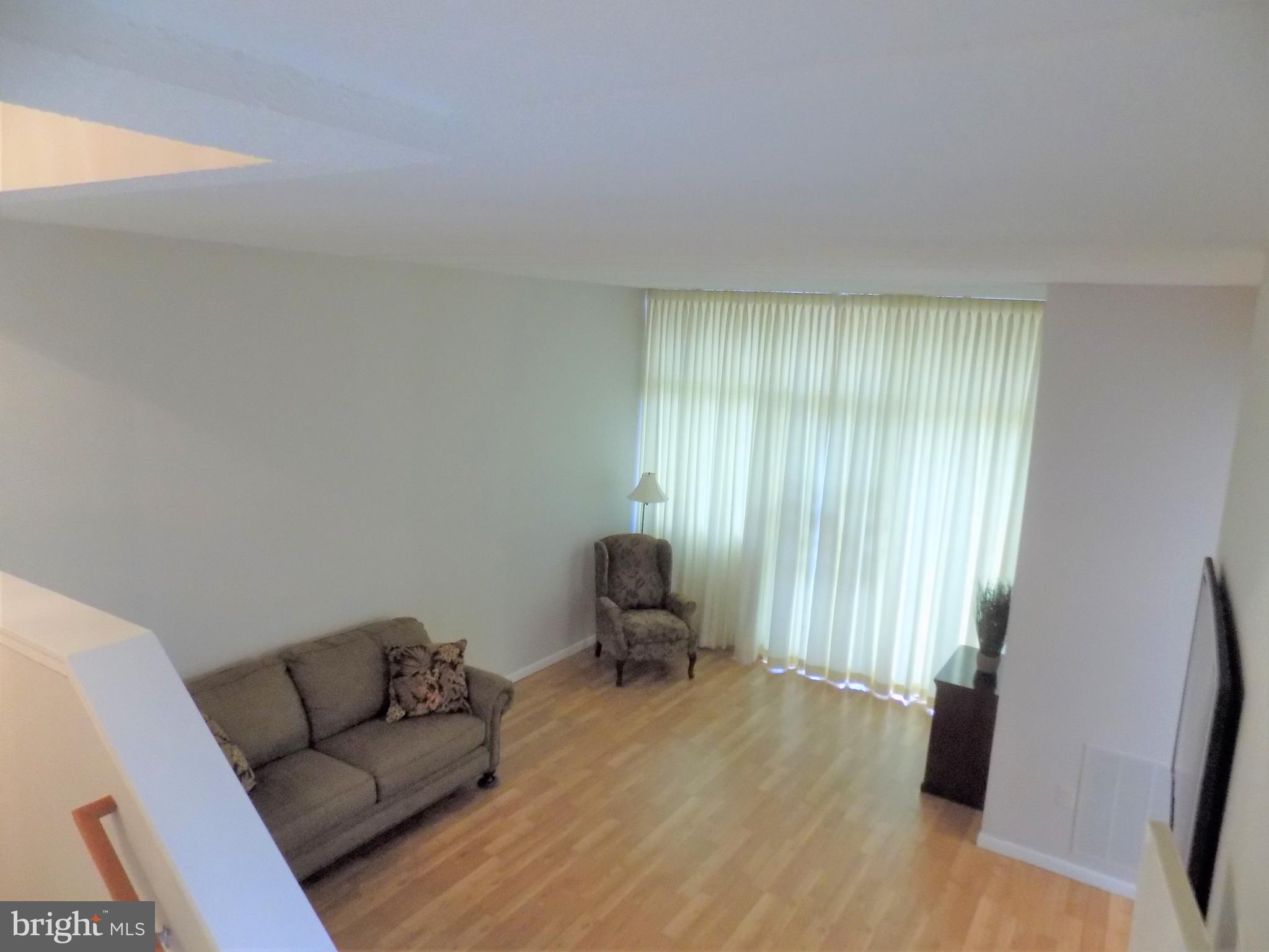 11564 Rolling Green Court, Unit 101 Reston, VA 20191 - Photo 4 of 71 Family room with soaring 2 story ceilings