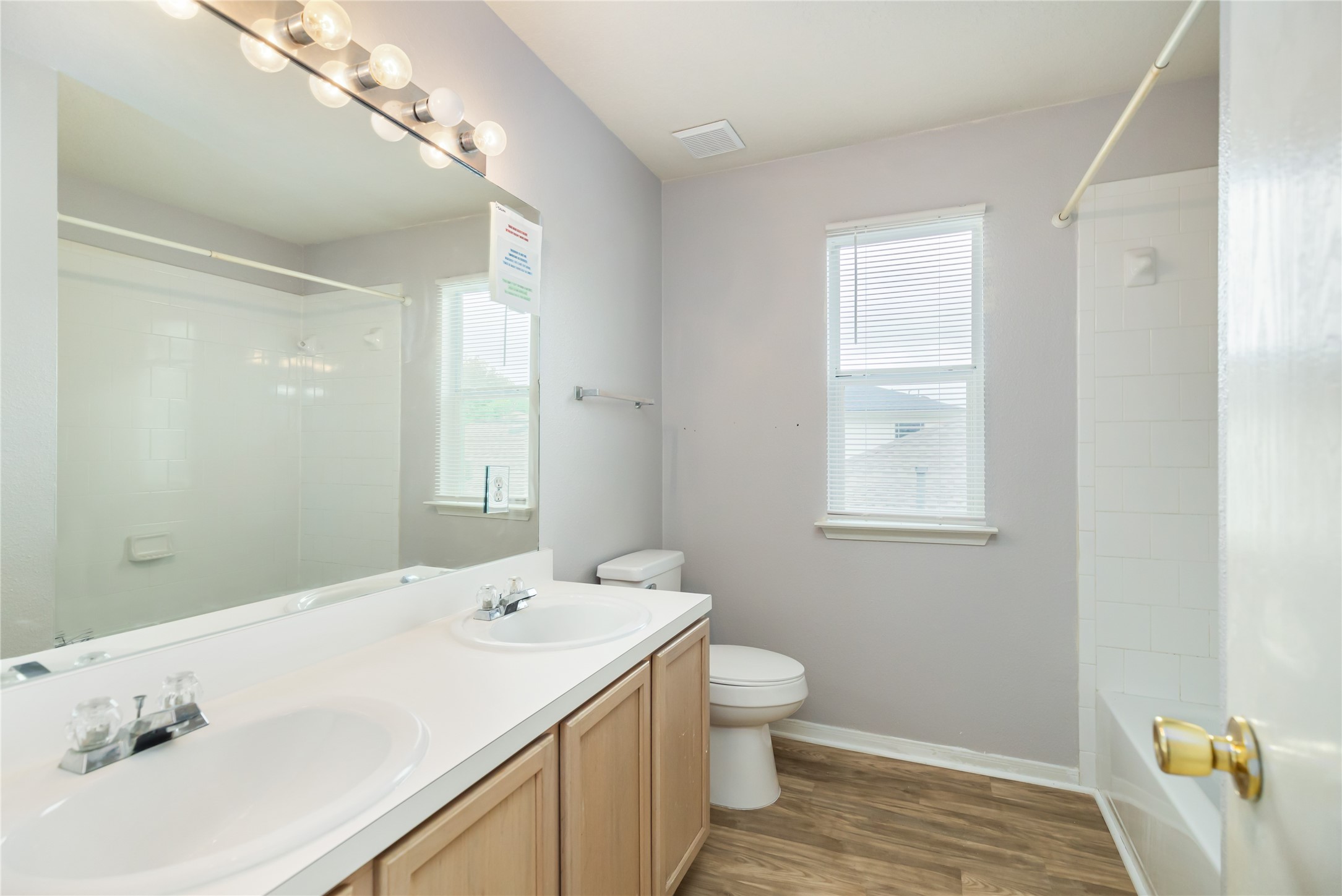 17334 Turquoise Stream Drive Houston, TX 77095 - Photo 27 of 31 a bathroom with a sink a toilet and a mirror