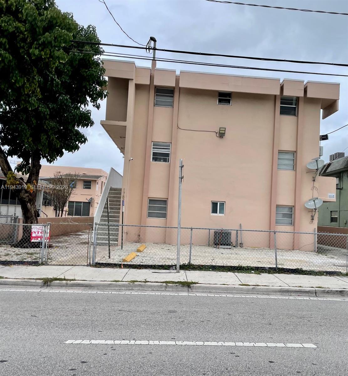 1787 Southwest 7th Street, Unit 4 Miami, FL 33135 - Photo 1 of 3 a white building that has a sign on it